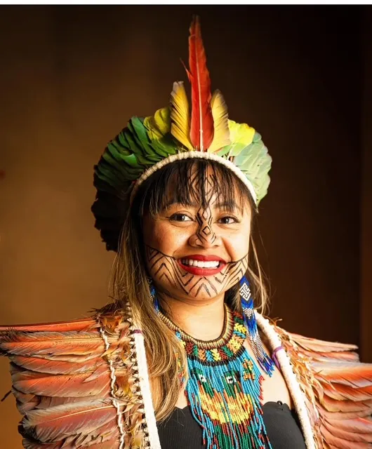 Rita of the Huni Kuin people in traditional dress and face paint