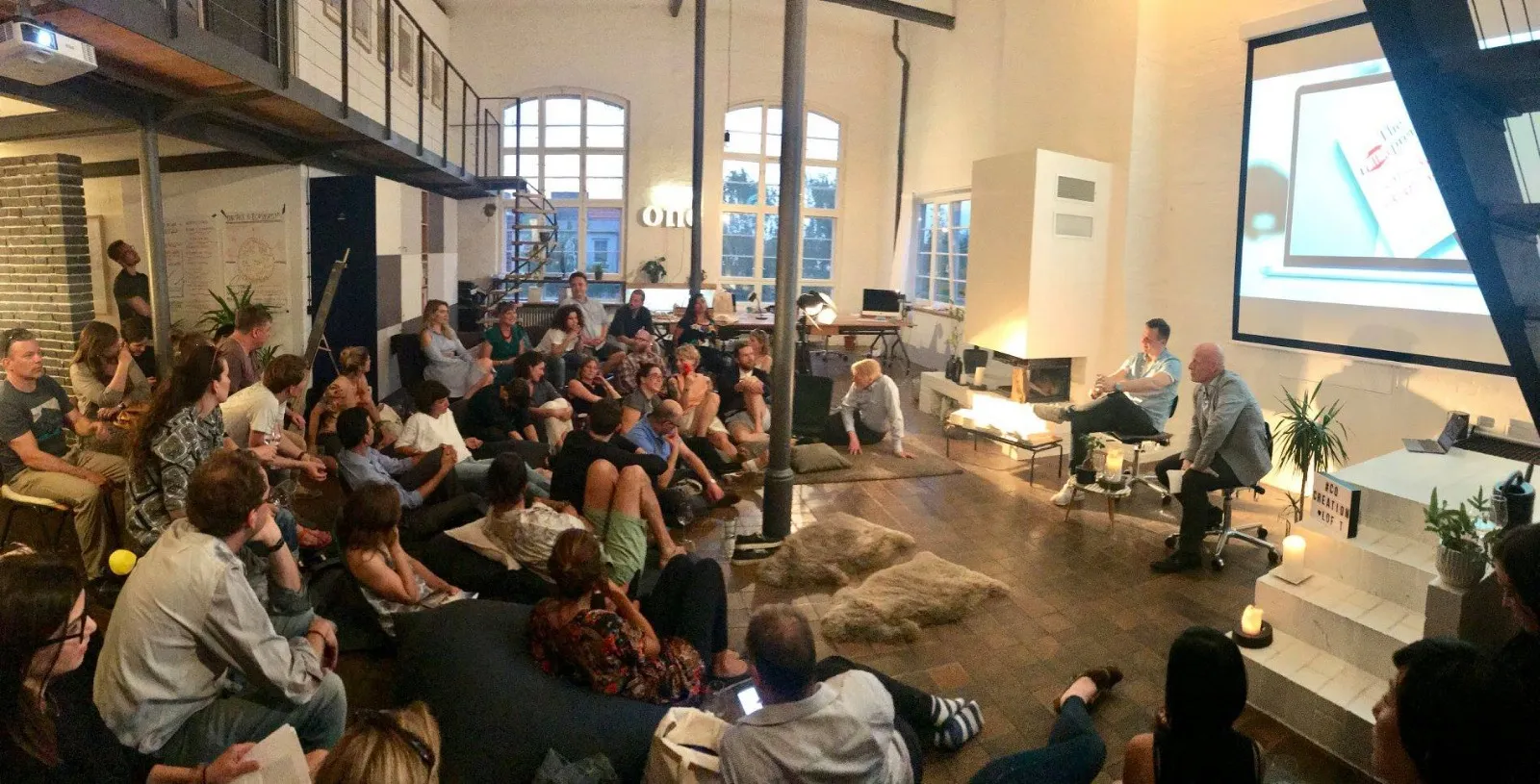 Participants listening at a Wisdom Salon in the Co-Creation Loft